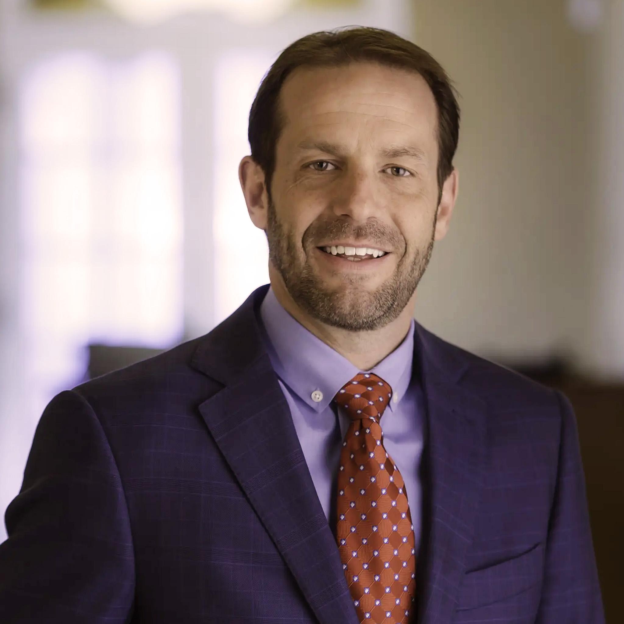 Portrait of Greg Austin smiling