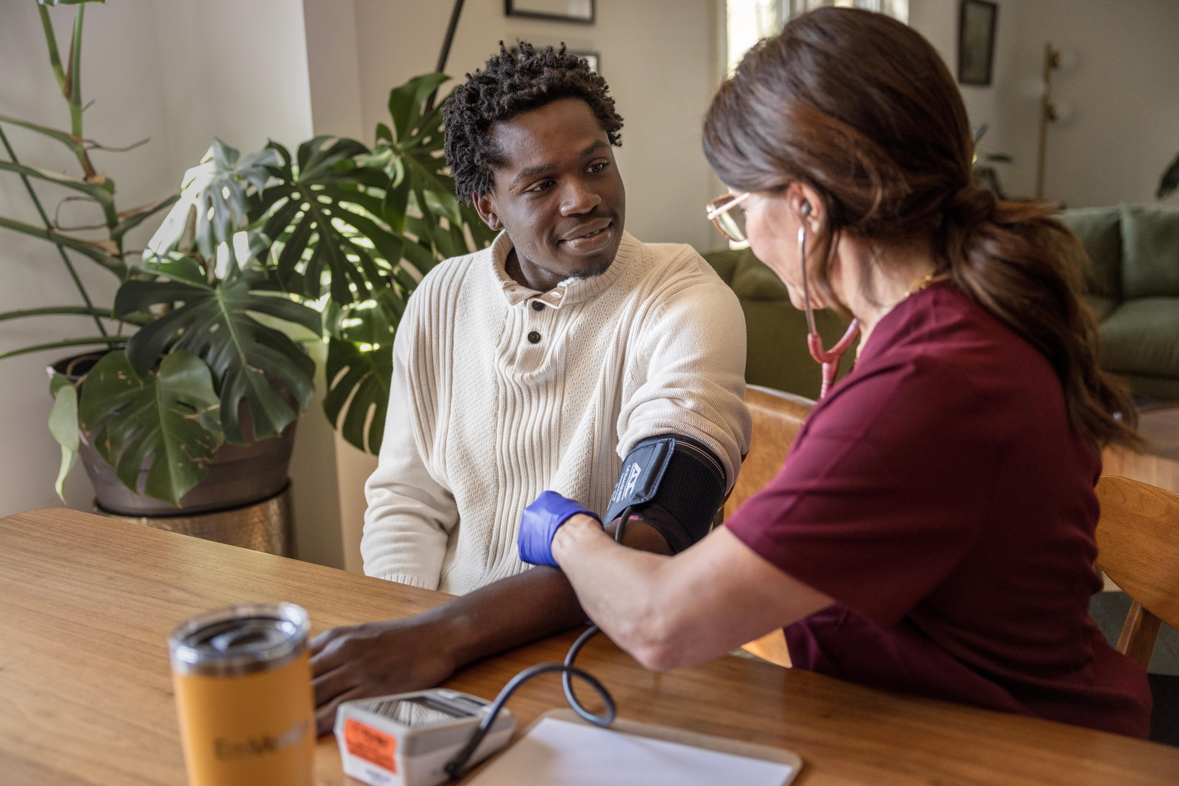 EmVenio Certified Mobile Research Clinician examining patient